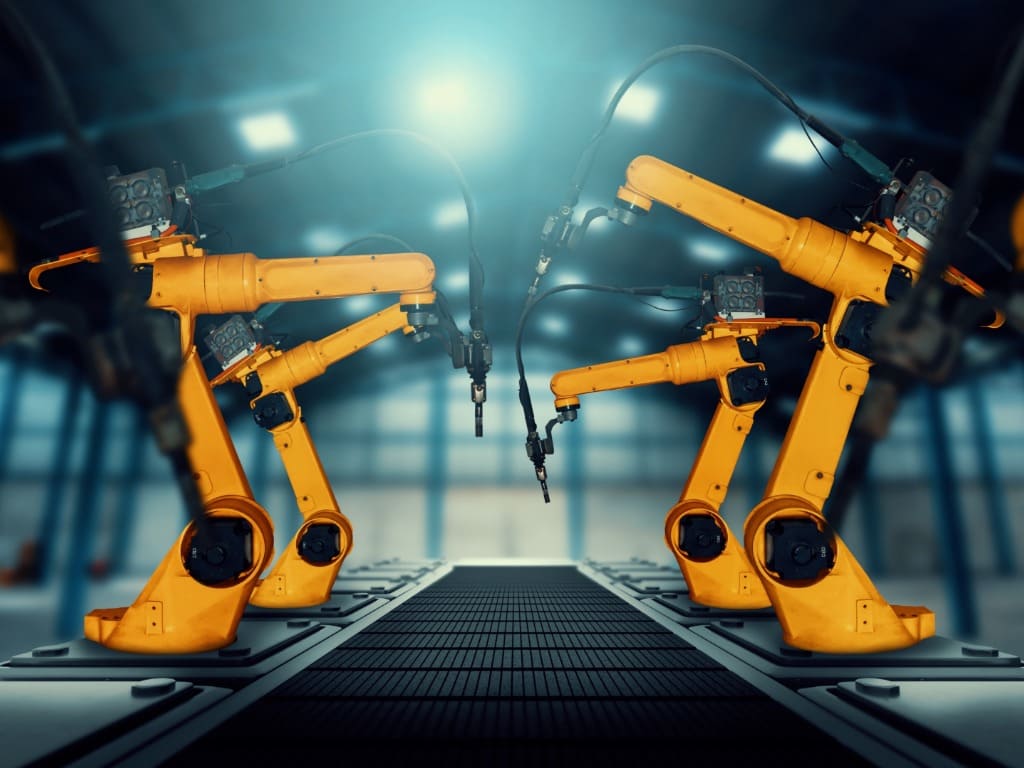 industria 4.0 brazos robots amarillos 